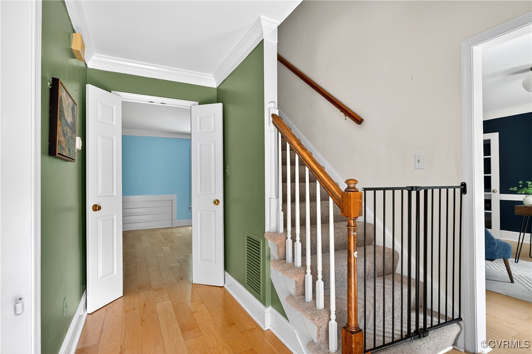 3921 Timber Ridge Road Midlothian, VA 23112 - Photo 5 of 47 a view of a hallway with wooden floor and staircase