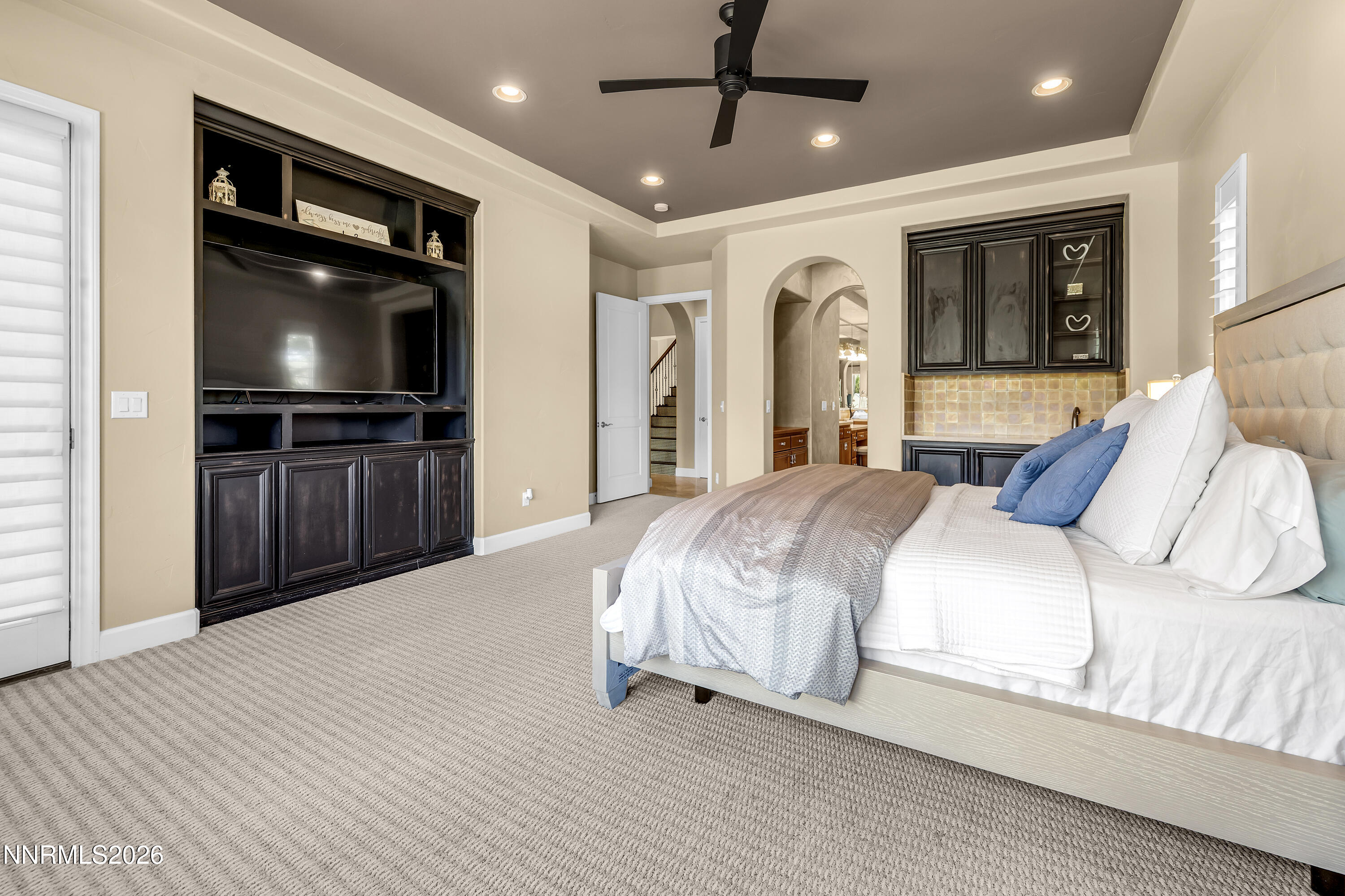 1898 Laurel Ridge Drive Reno, NV 89523 - Photo 9 of 87 a spacious bedroom with a bed and a flat screen tv