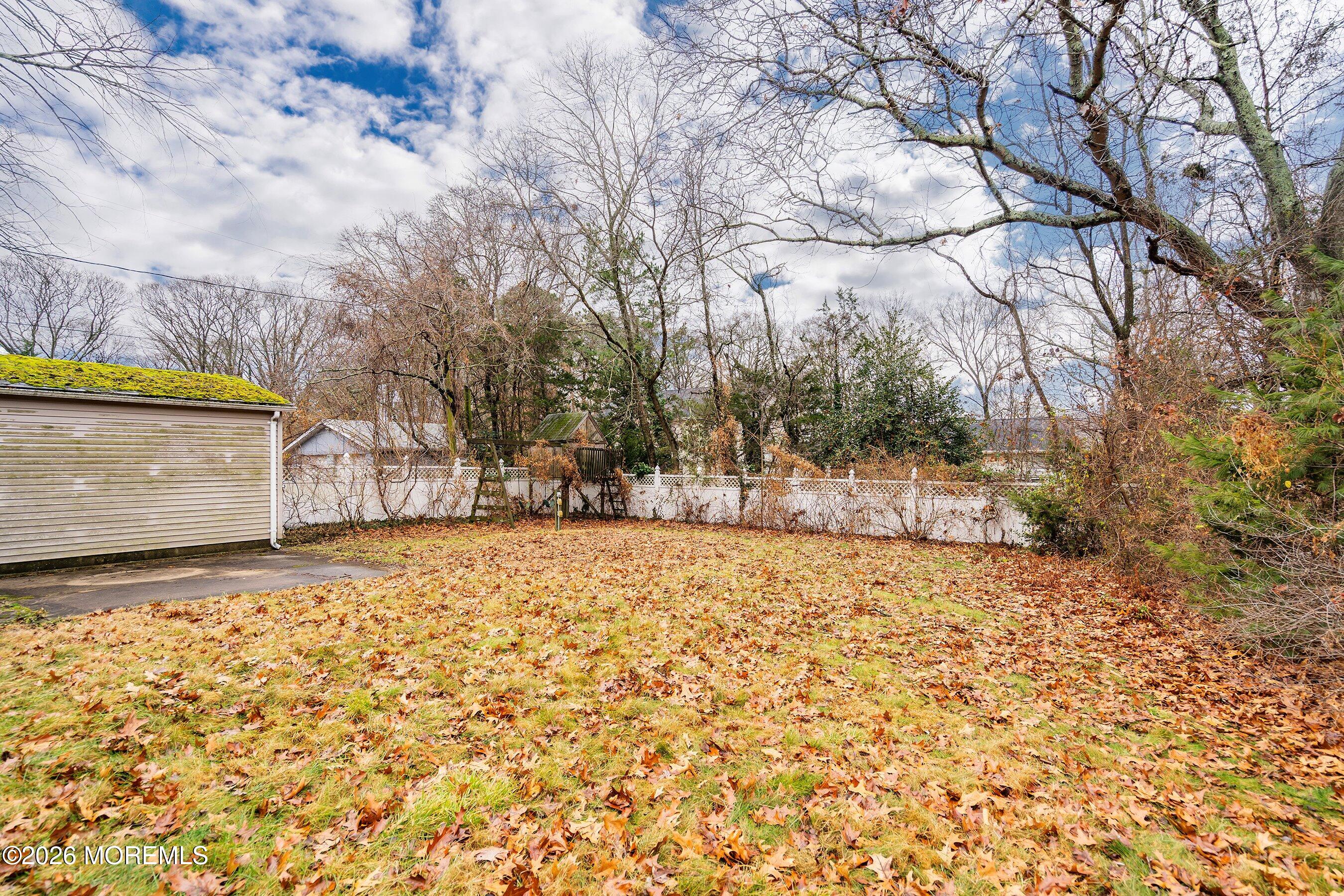 546 Princess Court Toms River, NJ 08753 - Photo 13 of 14 a street view with wooden fence