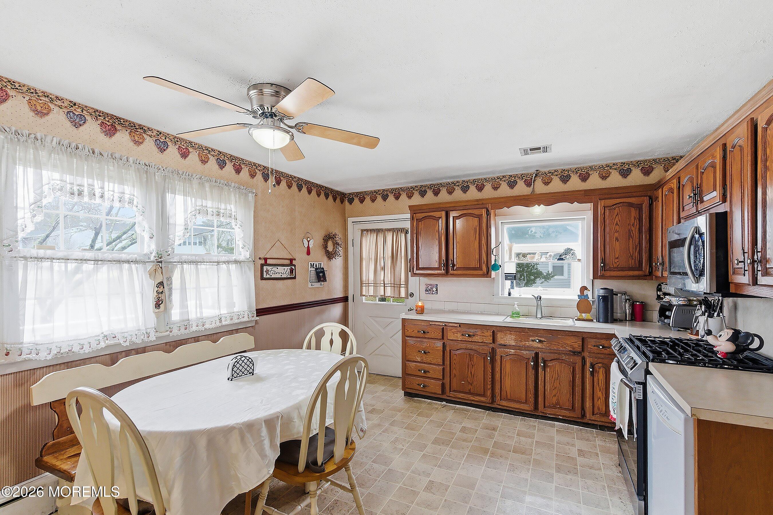 546 Princess Court Toms River, NJ 08753 - Photo 5 of 14 a large kitchen with a table and chairs