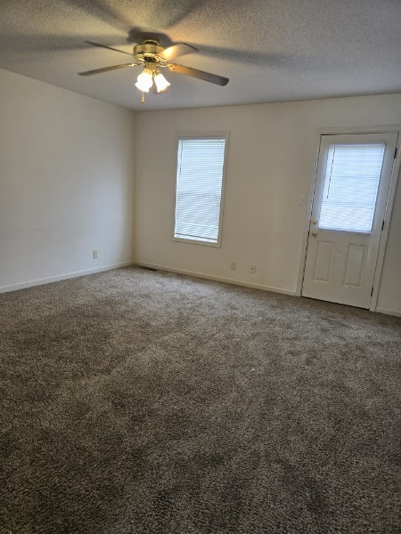 235 State Line Road Oak Grove, KY 42262 - Photo 7 of 18 an empty room with windows and fan