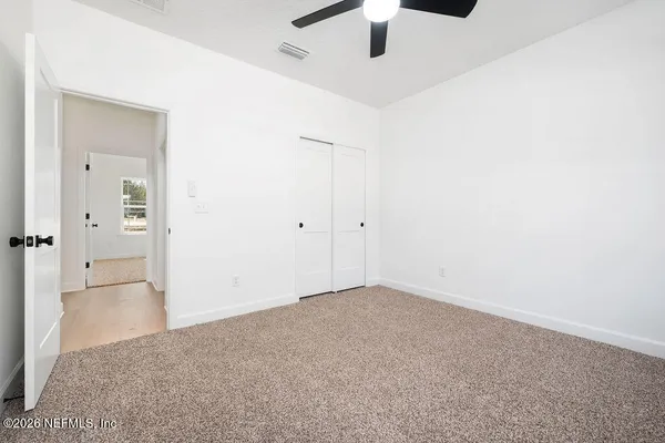 an empty room with fan