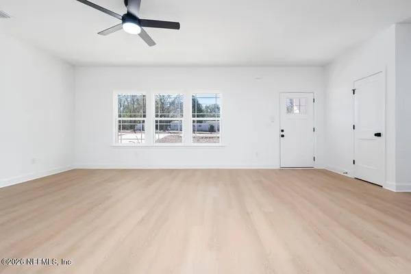 an empty room with windows