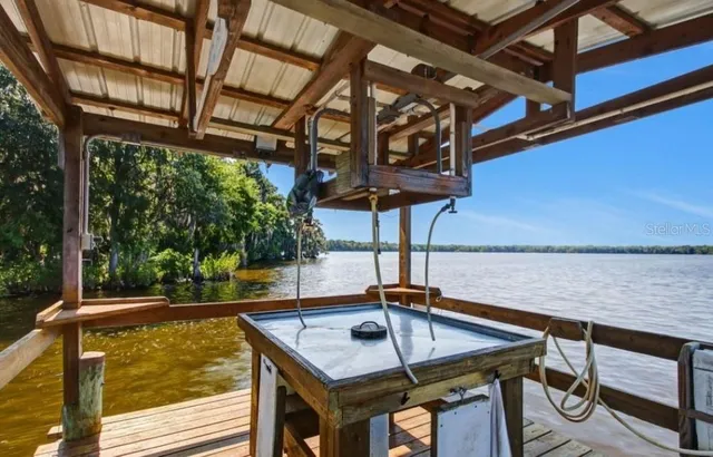 a view of a swimming pool with a patio and couches