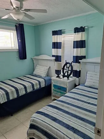 a bedroom with double bed and a window