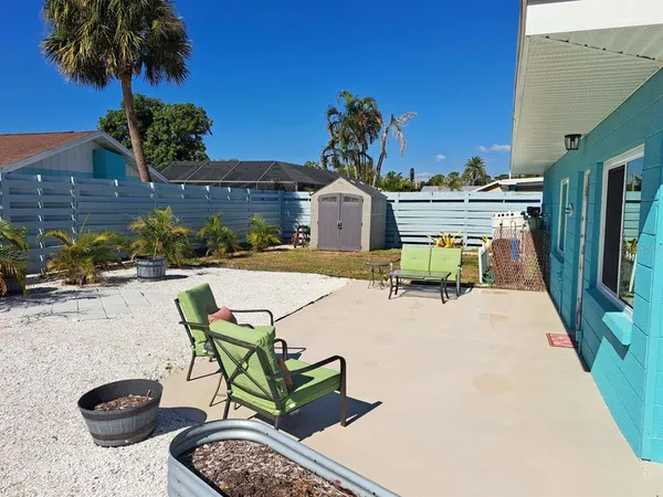 a view of a swimming pool with a lounge chairs