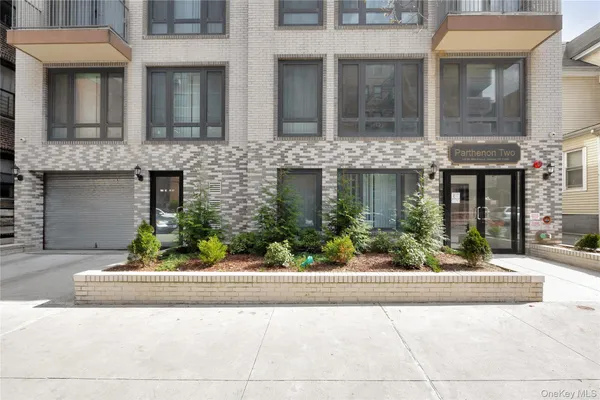 a view of a building with potted plants