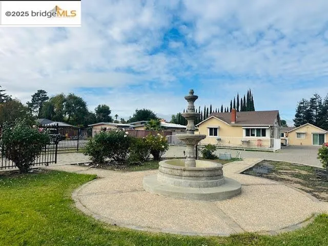 a view of a house with swimming pool and sitting area