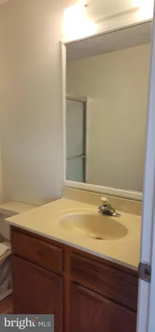 a bathroom with a sink and vanity