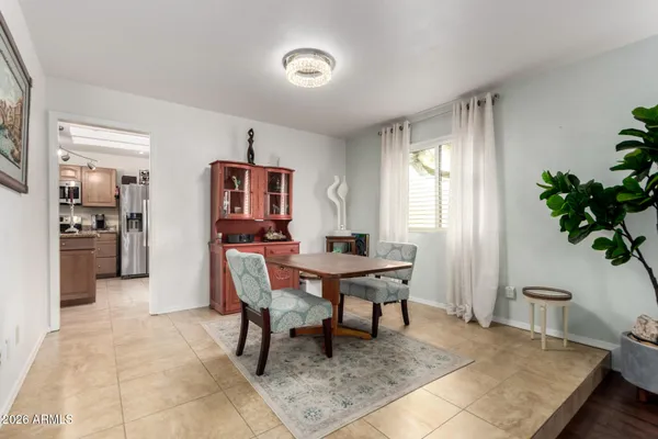 a kitchen with stainless steel appliances granite countertop a sink dishwasher stove top oven and refrigerator with wooden floor