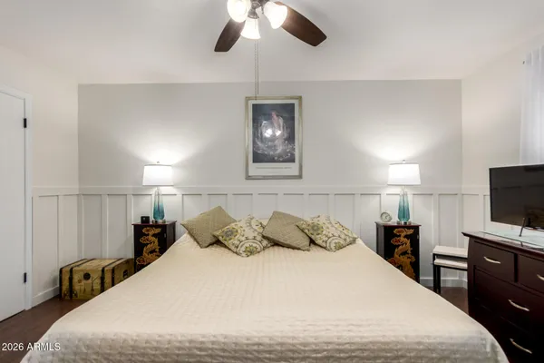 a bathroom with a toilet a sink and a mirror