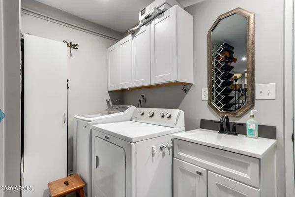 a view of a house with pool and chairs