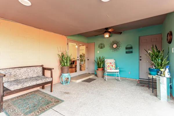 a view of a backyard with sitting area