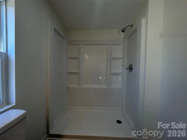 a view of wooden floor in a bathroom