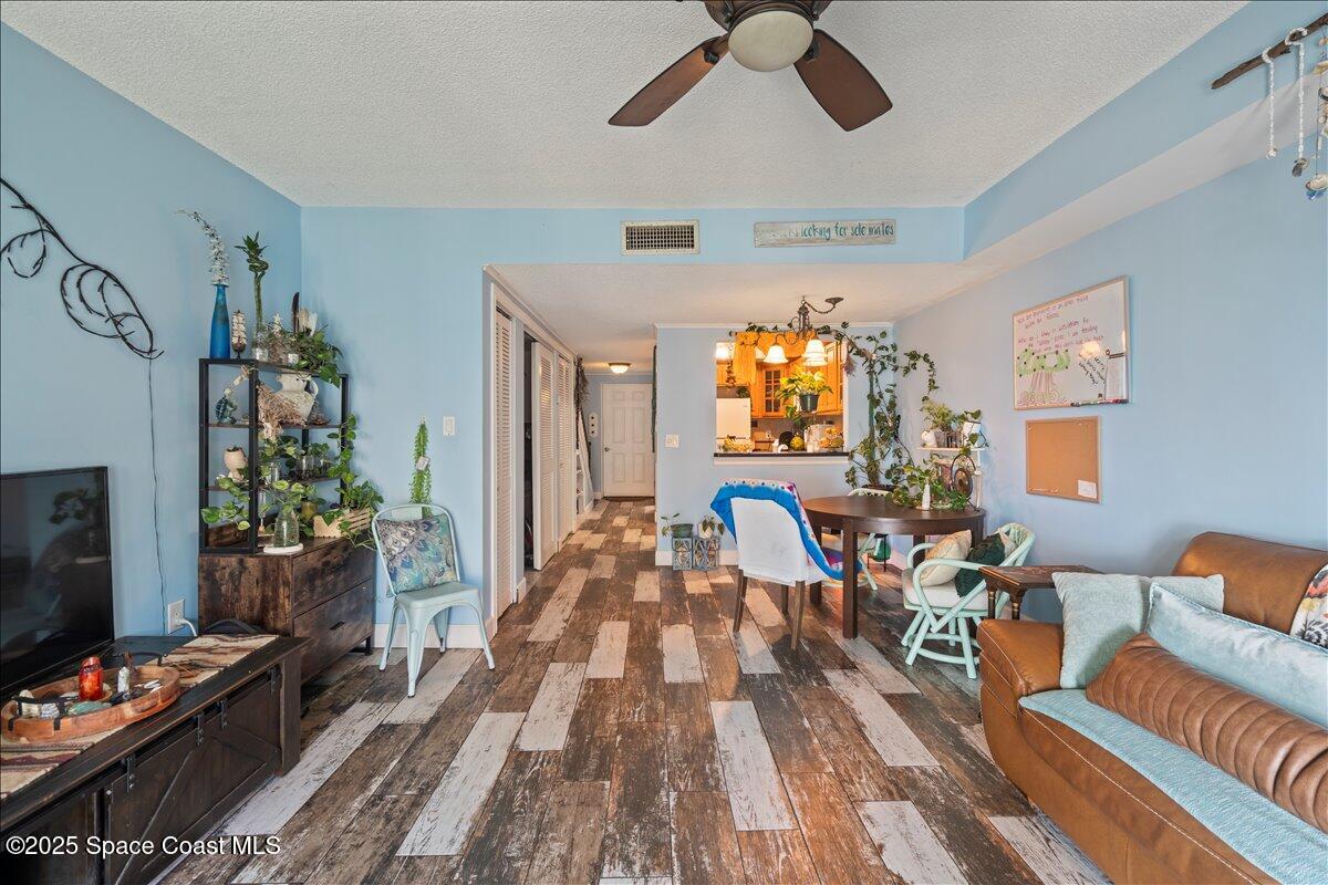 199 Florida A1A, Unit D201 Satellite Beach, FL 32937 - Photo 14 of 39 a living room with furniture and a flat screen tv