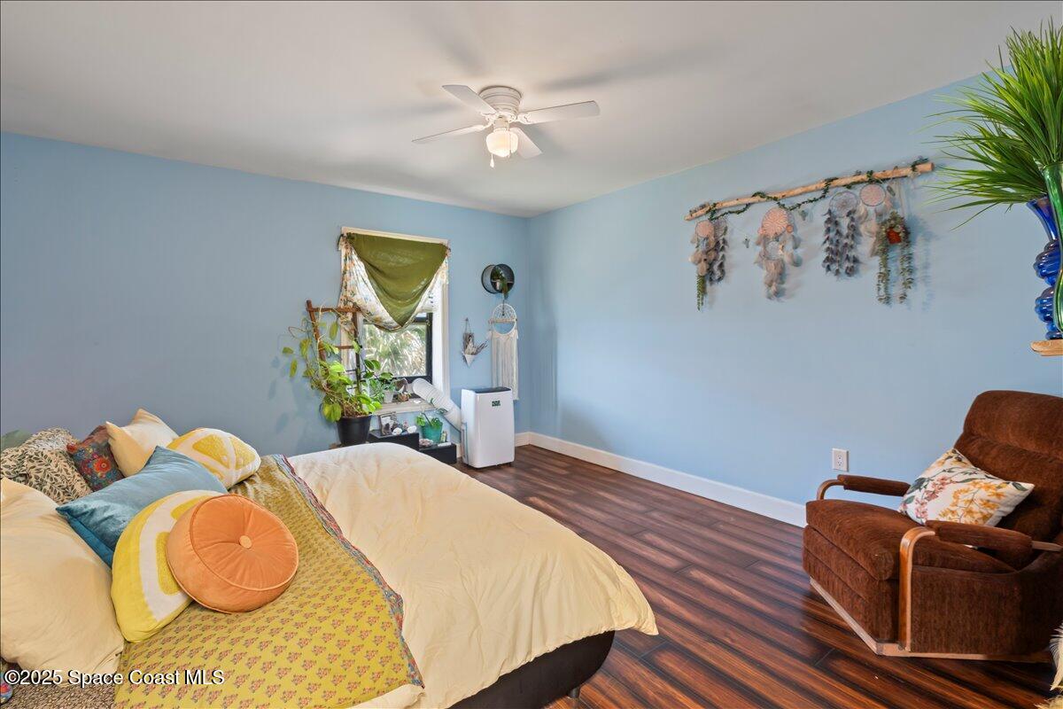 199 Florida A1A, Unit D201 Satellite Beach, FL 32937 - Photo 22 of 39 a bed room with a bed and a chair