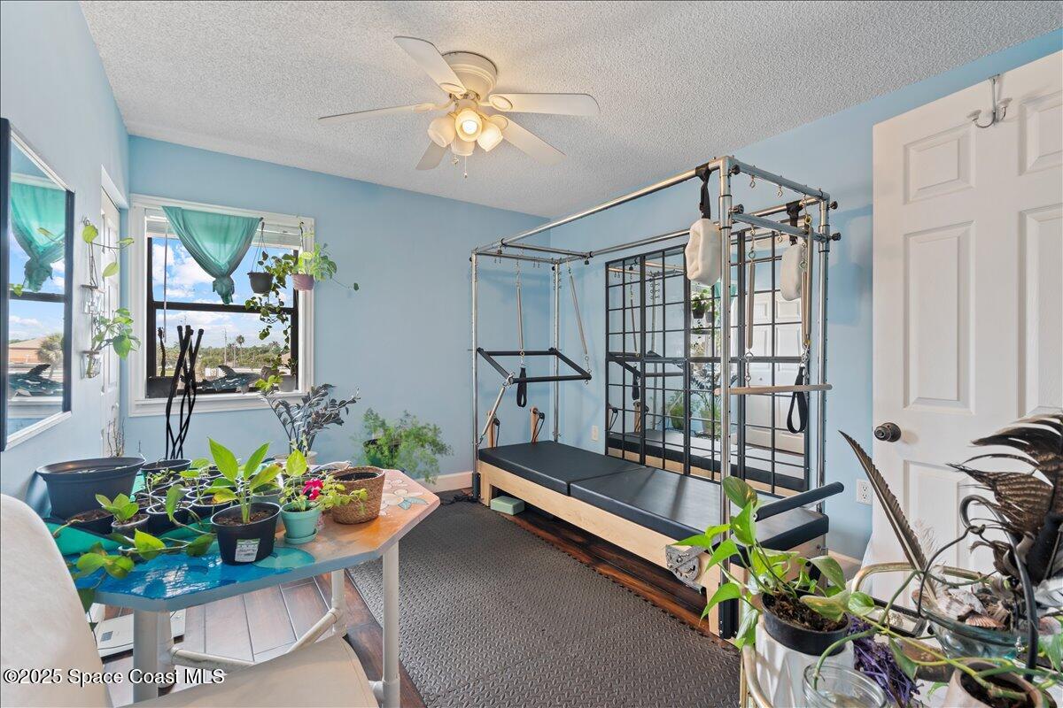 199 Florida A1A, Unit D201 Satellite Beach, FL 32937 - Photo 28 of 39 a sitting room with furniture and a chandelier