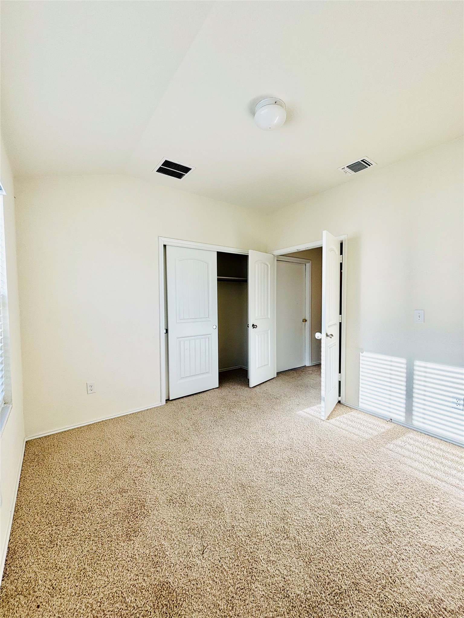 15125 Harkness Pass Austin, TX 78725 - Photo 14 of 23 a view of an empty room with closet and a window
