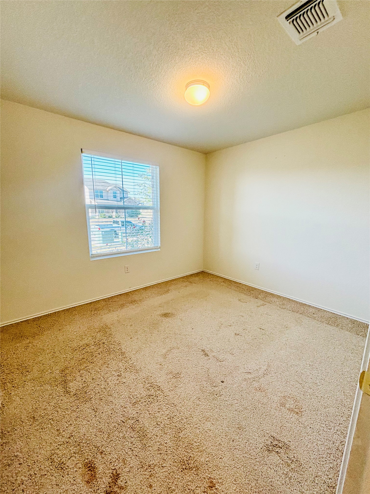 15125 Harkness Pass Austin, TX 78725 - Photo 2 of 23 an empty room with windows