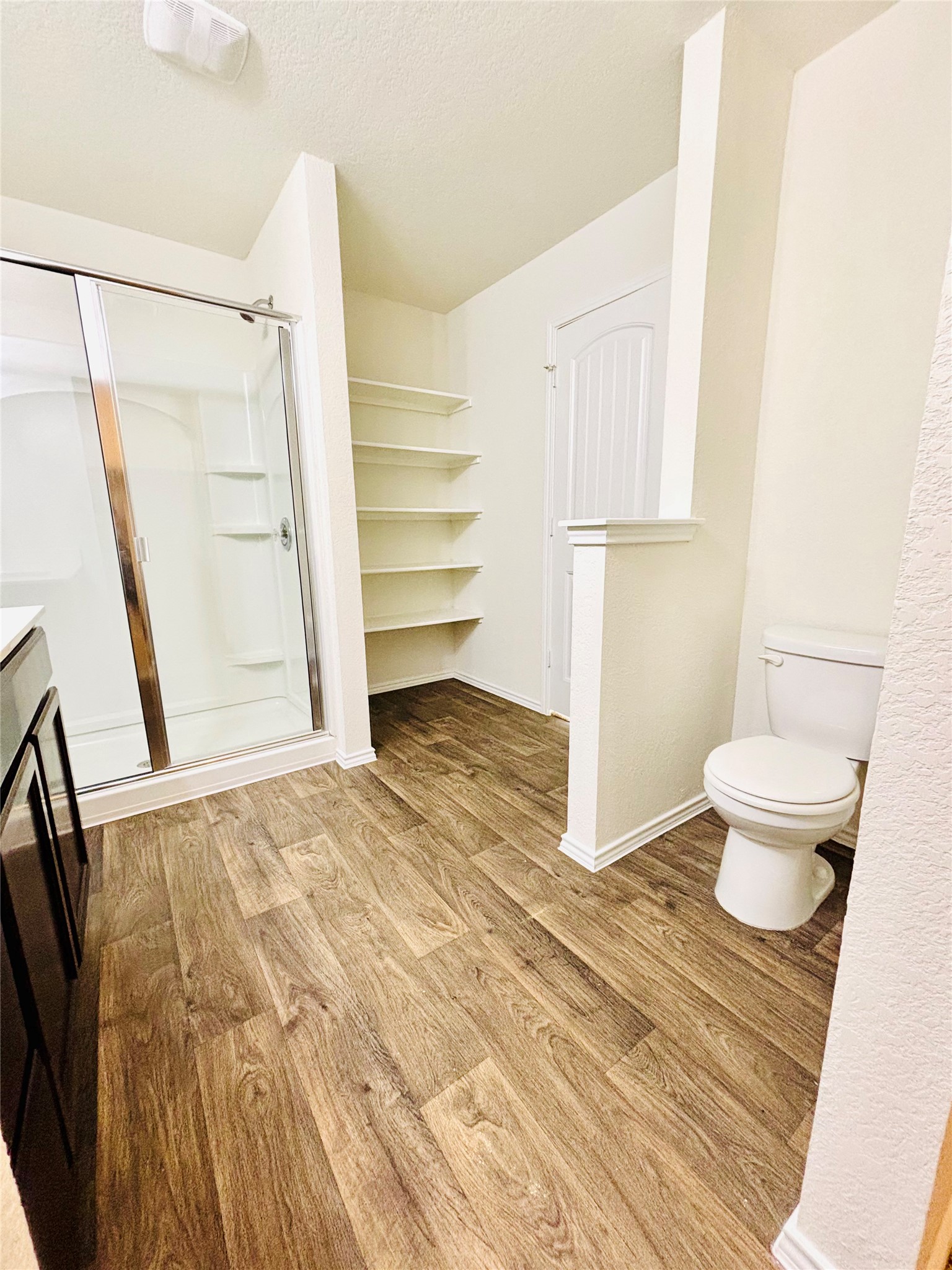 15125 Harkness Pass Austin, TX 78725 - Photo 20 of 23 a view of bathroom and wooden floor