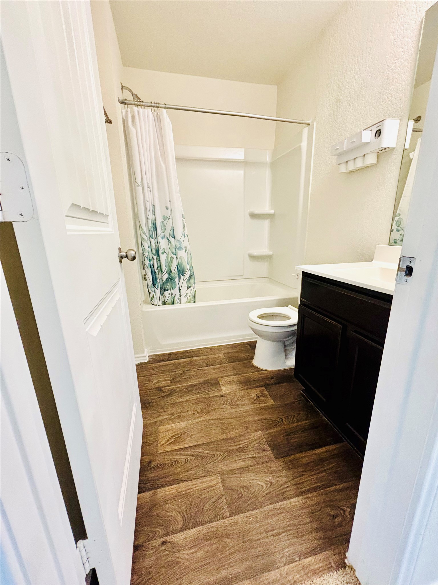 15125 Harkness Pass Austin, TX 78725 - Photo 5 of 23 a bathroom with a sink a toilet a window and a shower