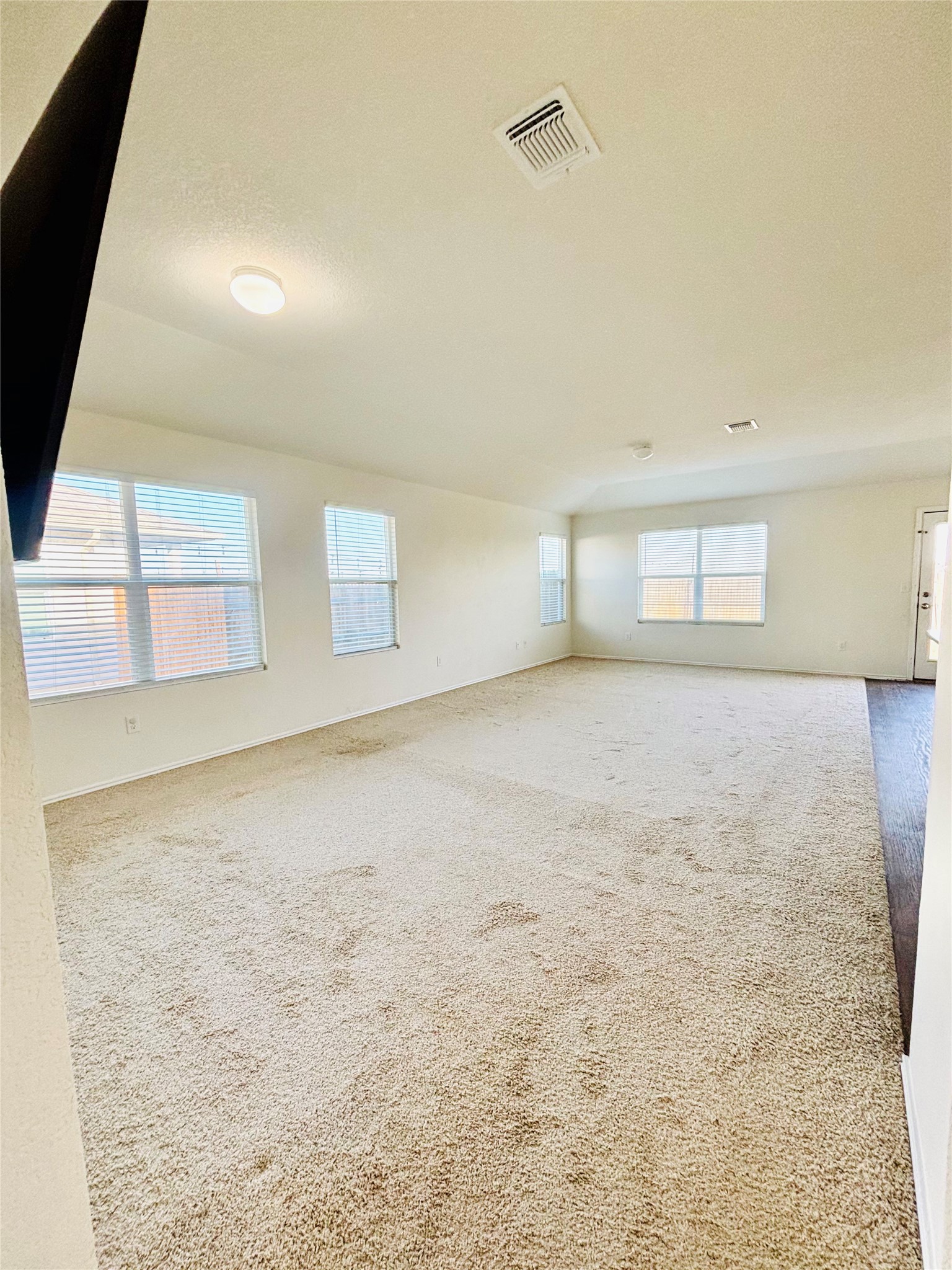15125 Harkness Pass Austin, TX 78725 - Photo 10 of 23 a view of an empty room with a window