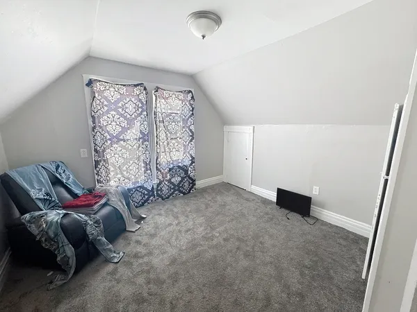 a bed room with a bed and a couch