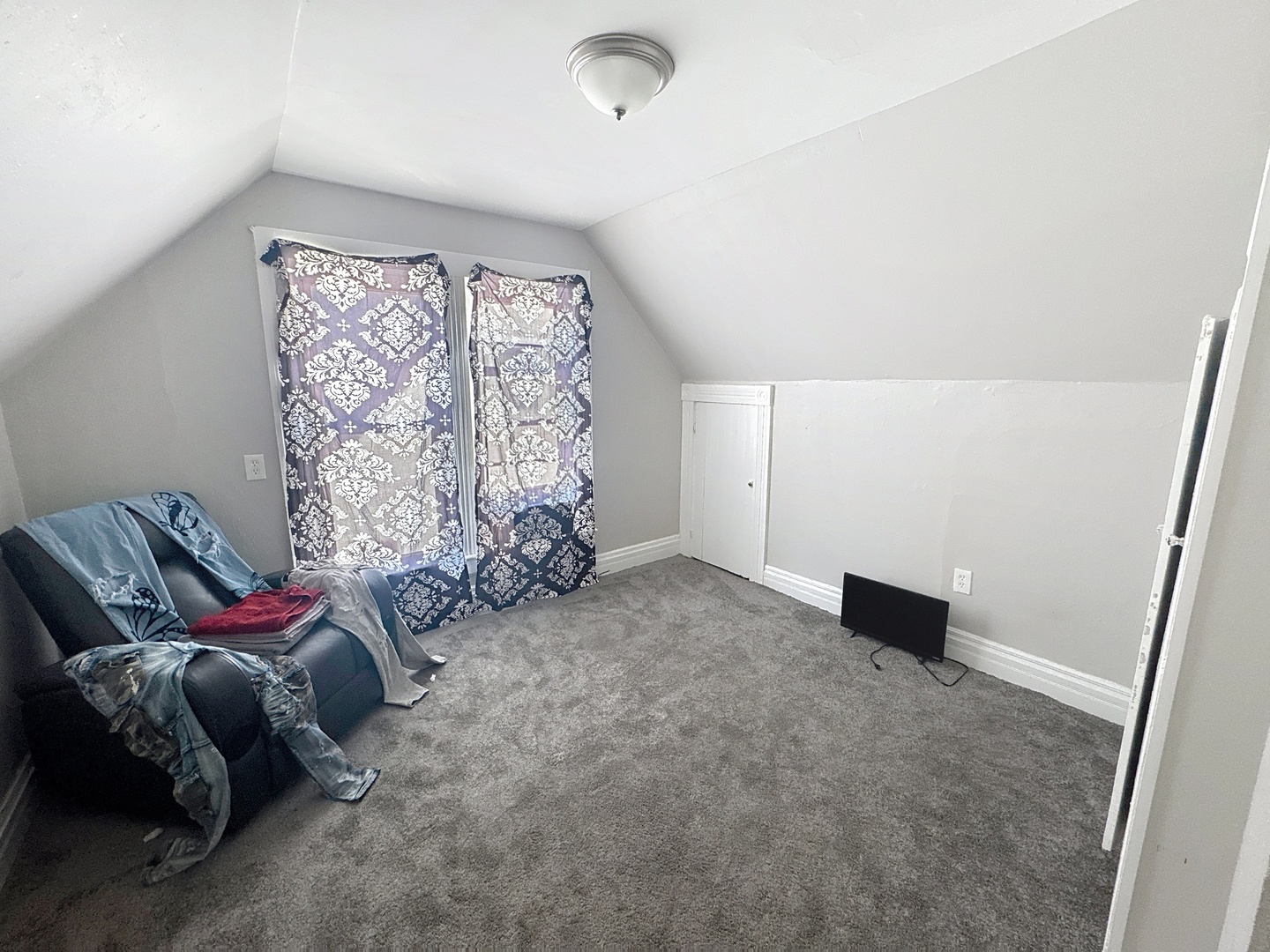 2748 11th Avenue Moline, IL 61265 - Photo 11 of 16 a bed room with a bed and a couch