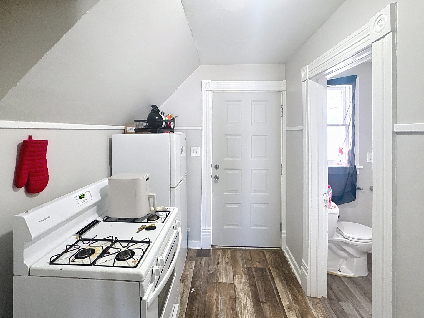 2748 11th Avenue Moline, IL 61265 - Photo 12 of 16 a kitchen with a refrigerator and a stove