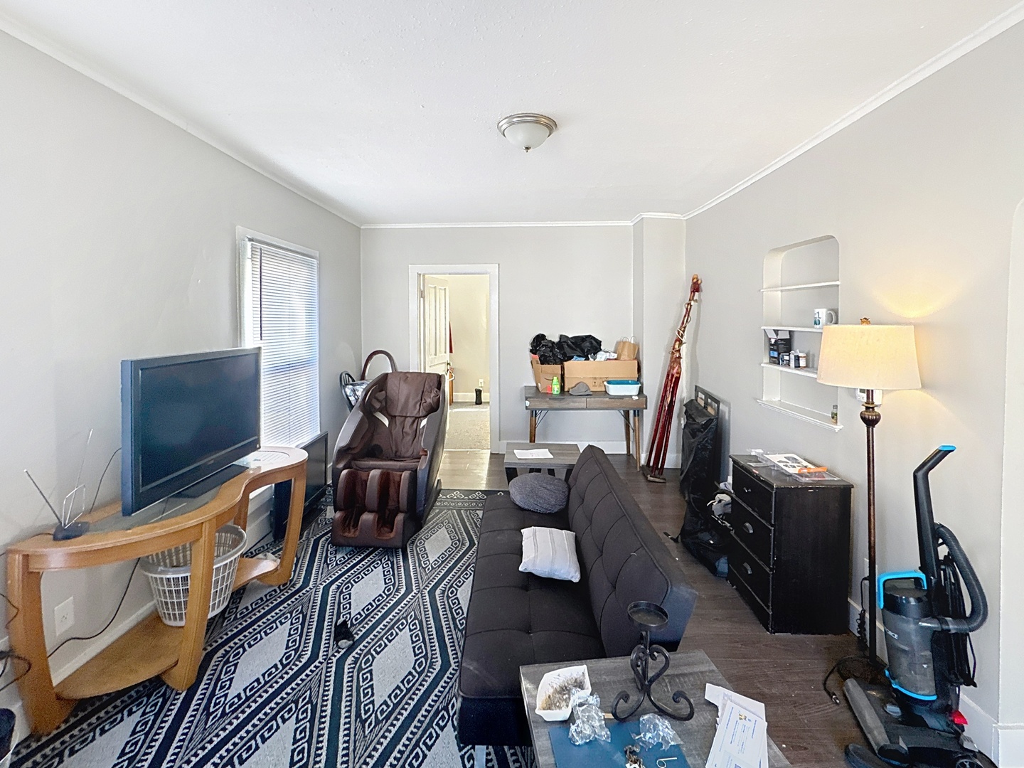 2748 11th Avenue Moline, IL 61265 - Photo 4 of 16 a living room with furniture a flat screen tv and a fireplace