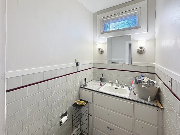 a bathroom with a sink and a mirror