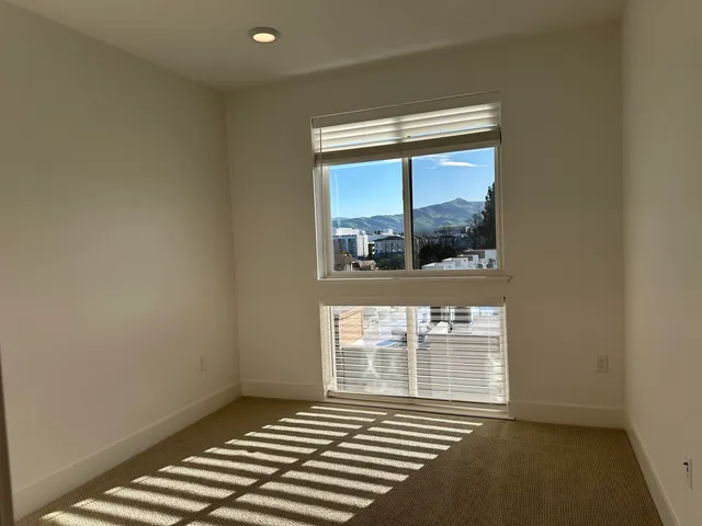 a view of an empty room with a window