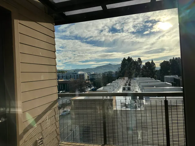 a view of a balcony with city view
