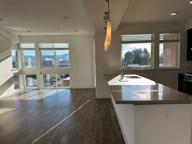 a bathroom with a sink and a large window