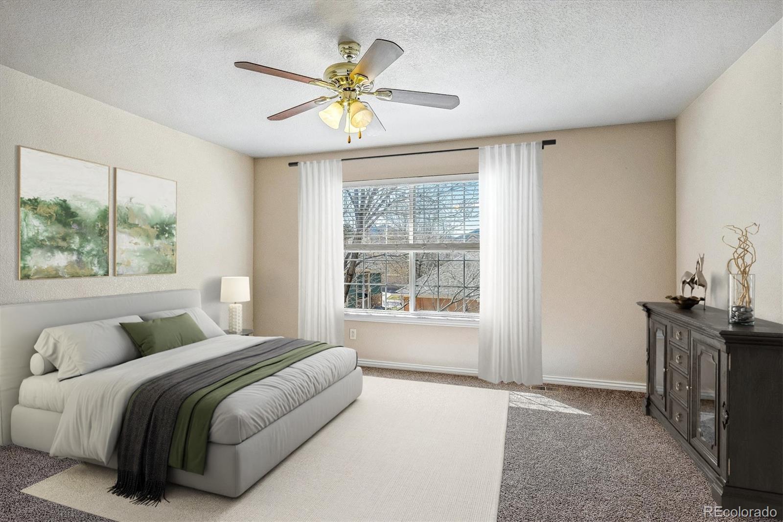 4545 South Taft Way Morrison, CO 80465 - Photo 19 of 24 a bedroom with a bed and a chandelier