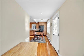 44 Holmes Road Dedham, MA 02026 - Photo 13 of 24 a view of a living room with a wooden floor