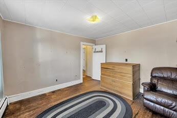 44 Holmes Road Dedham, MA 02026 - Photo 18 of 24 a bedroom with a bed and a couch