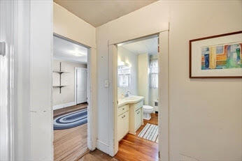 44 Holmes Road Dedham, MA 02026 - Photo 20 of 24 a bathroom with a sink and a mirror