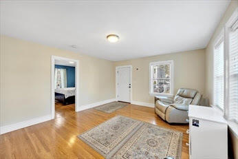 44 Holmes Road Dedham, MA 02026 - Photo 4 of 24 a living room with furniture and a rug