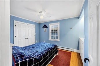 44 Holmes Road Dedham, MA 02026 - Photo 7 of 24 a bedroom with a bed and a window