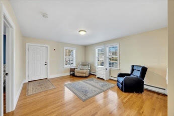 44 Holmes Road Dedham, MA 02026 - Photo 8 of 24 a living room with furniture and a window