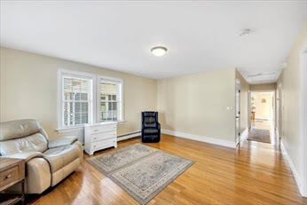 44 Holmes Road Dedham, MA 02026 - Photo 9 of 24 a living room with furniture and a window