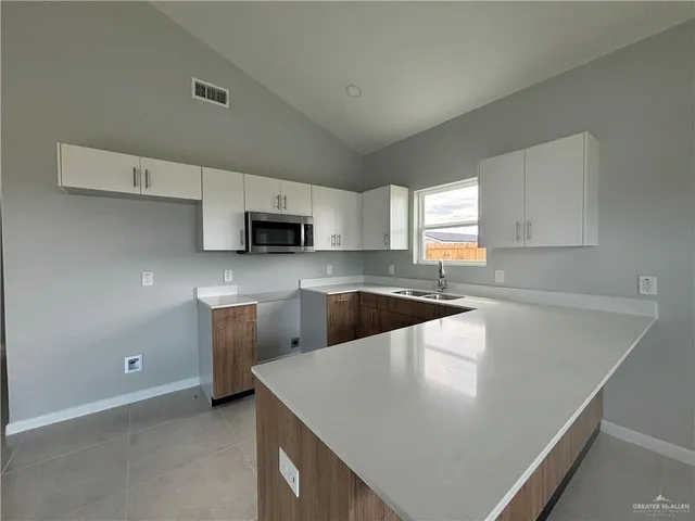 a view of a kitchen with a sink