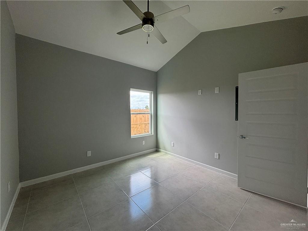 612 Oriole Road, Unit 3 Weslaco, TX 78596 - Photo 7 of 11 an empty room with windows and fan