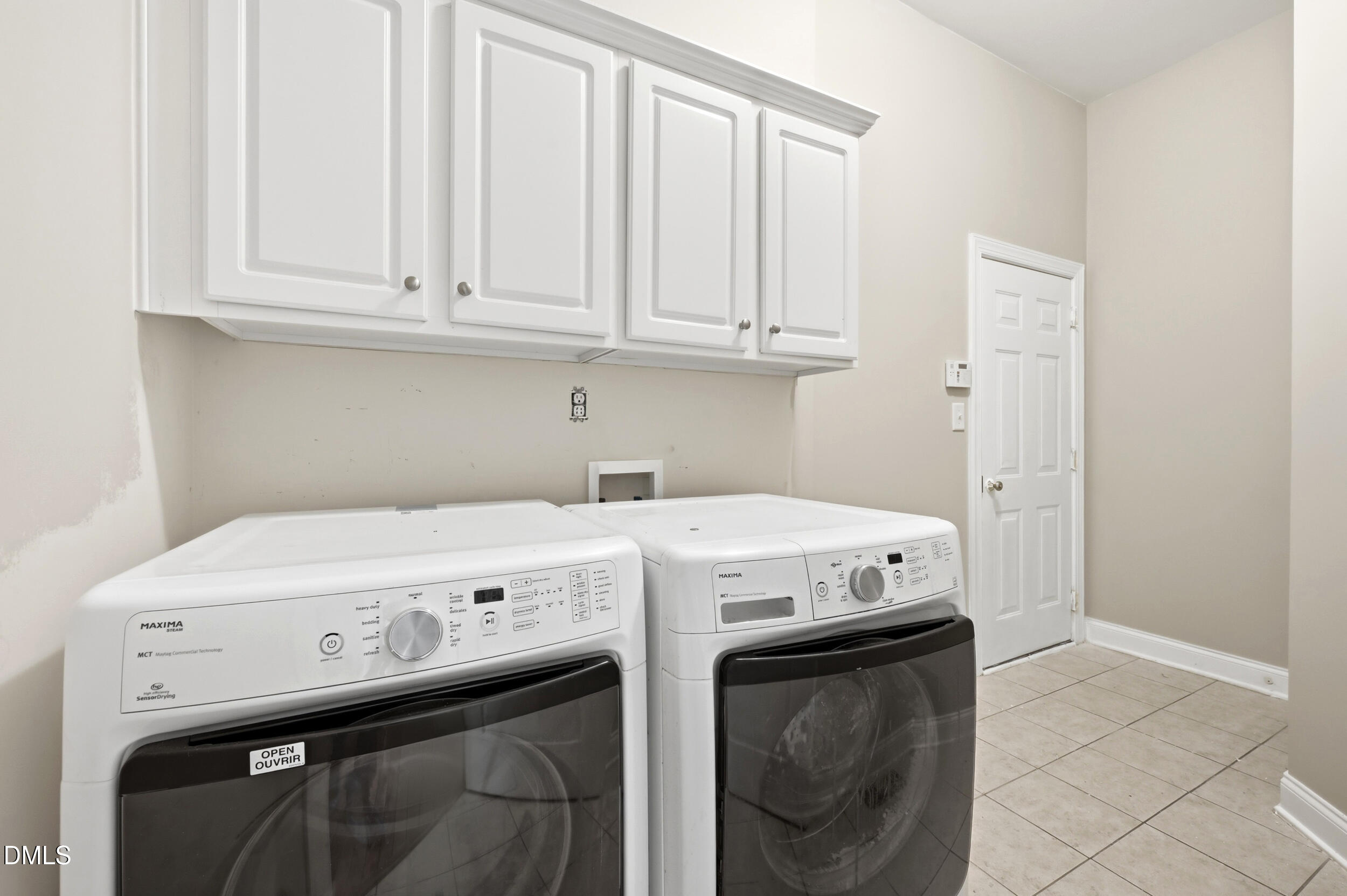 4803 Marena Place Durham, NC 27707 - Photo 11 of 42 a utility room with dryer and washer