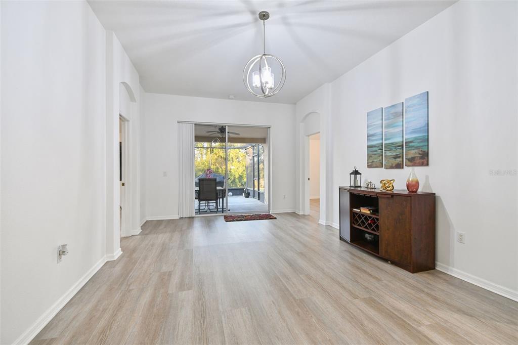 11478 Weston Course Loop Riverview, FL 33579 - Photo 11 of 30 a view of a livingroom with wooden floor and furniture