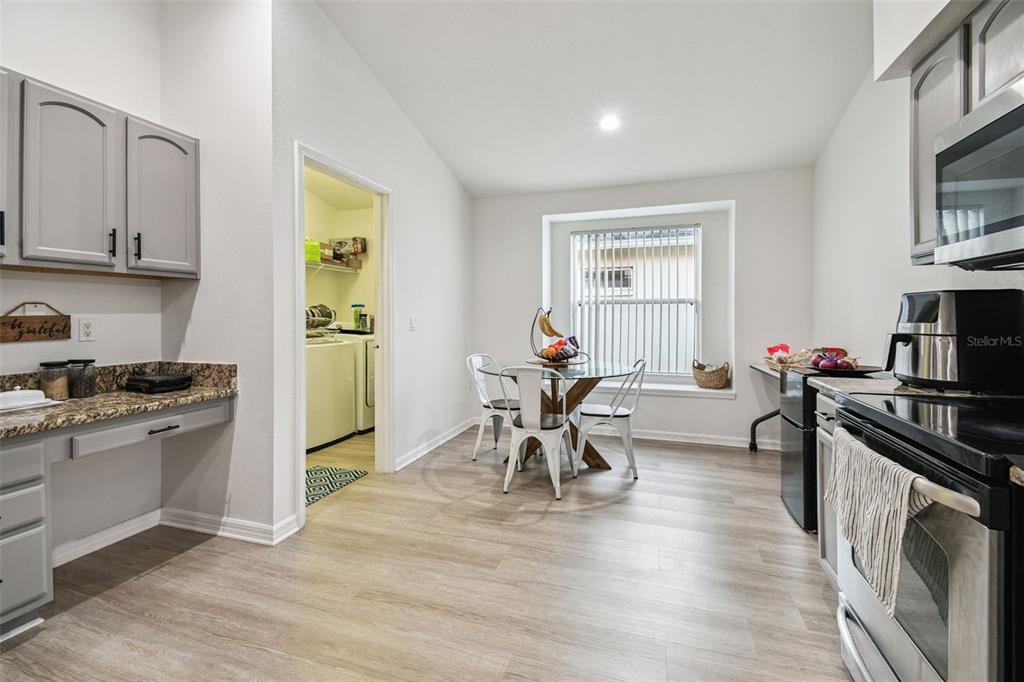11478 Weston Course Loop Riverview, FL 33579 - Photo 13 of 30 a view of a kitchen and dining room