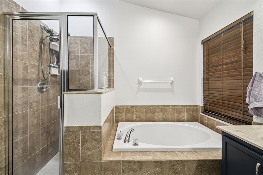 11478 Weston Course Loop Riverview, FL 33579 - Photo 17 of 30 a bathroom with a bathtub and shower