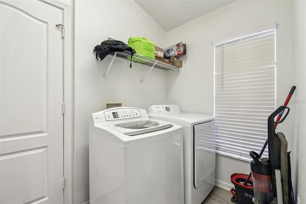 11478 Weston Course Loop Riverview, FL 33579 - Photo 23 of 30 a utility room with dryer and washer