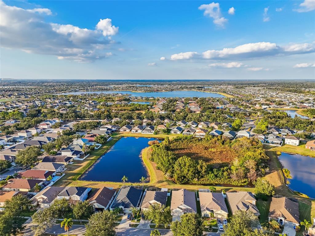 11478 Weston Course Loop Riverview, FL 33579 - Photo 27 of 30 an aerial view of residential building and lake